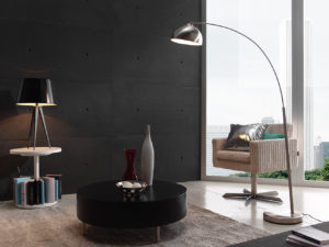 sitting room with one white chair and one floor lamp, black faux concrete wall in the back
