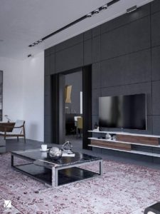 living room with television hanging against an anthracite concrete wall
