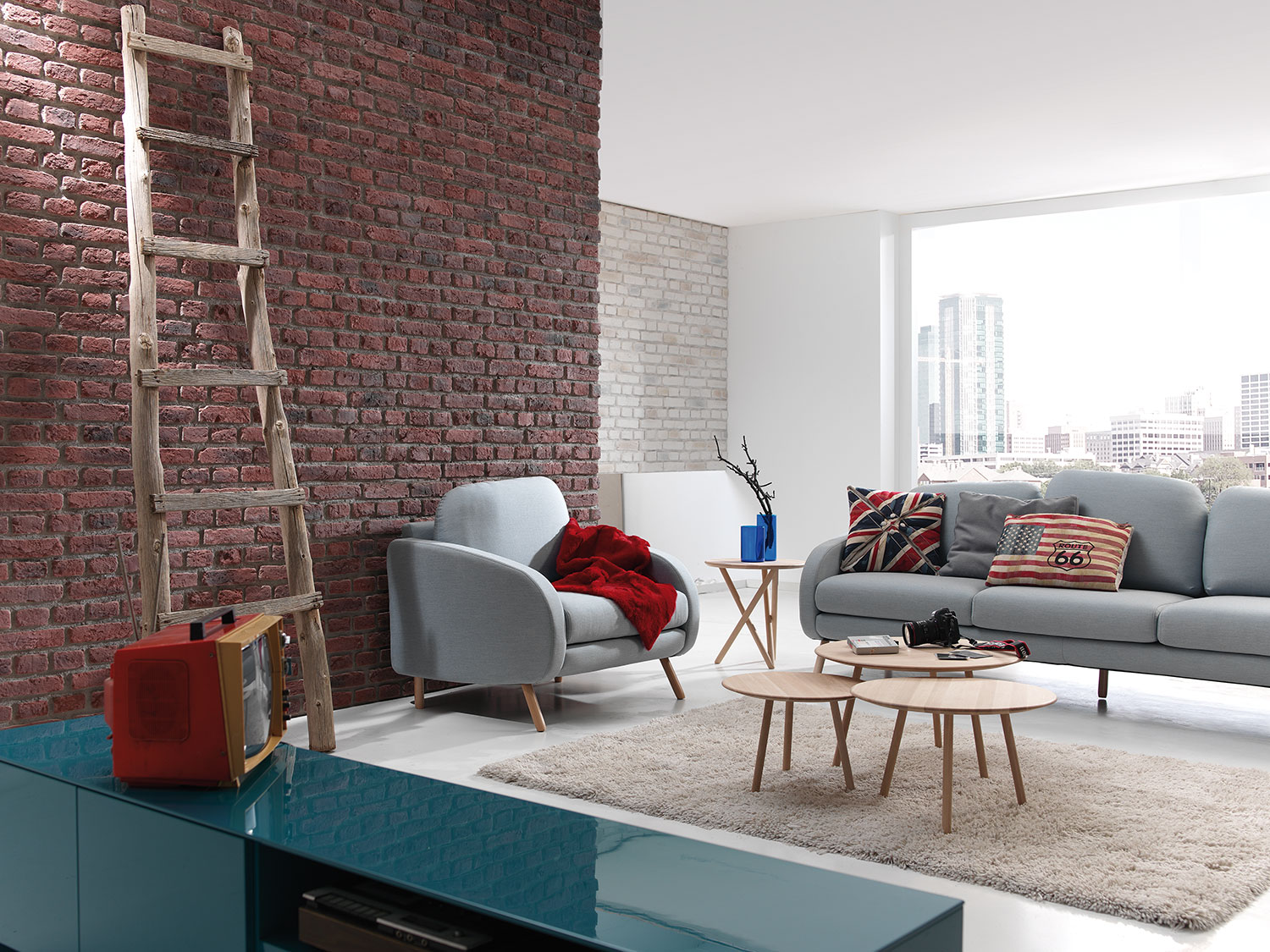 living room with two brick walls one red and one white