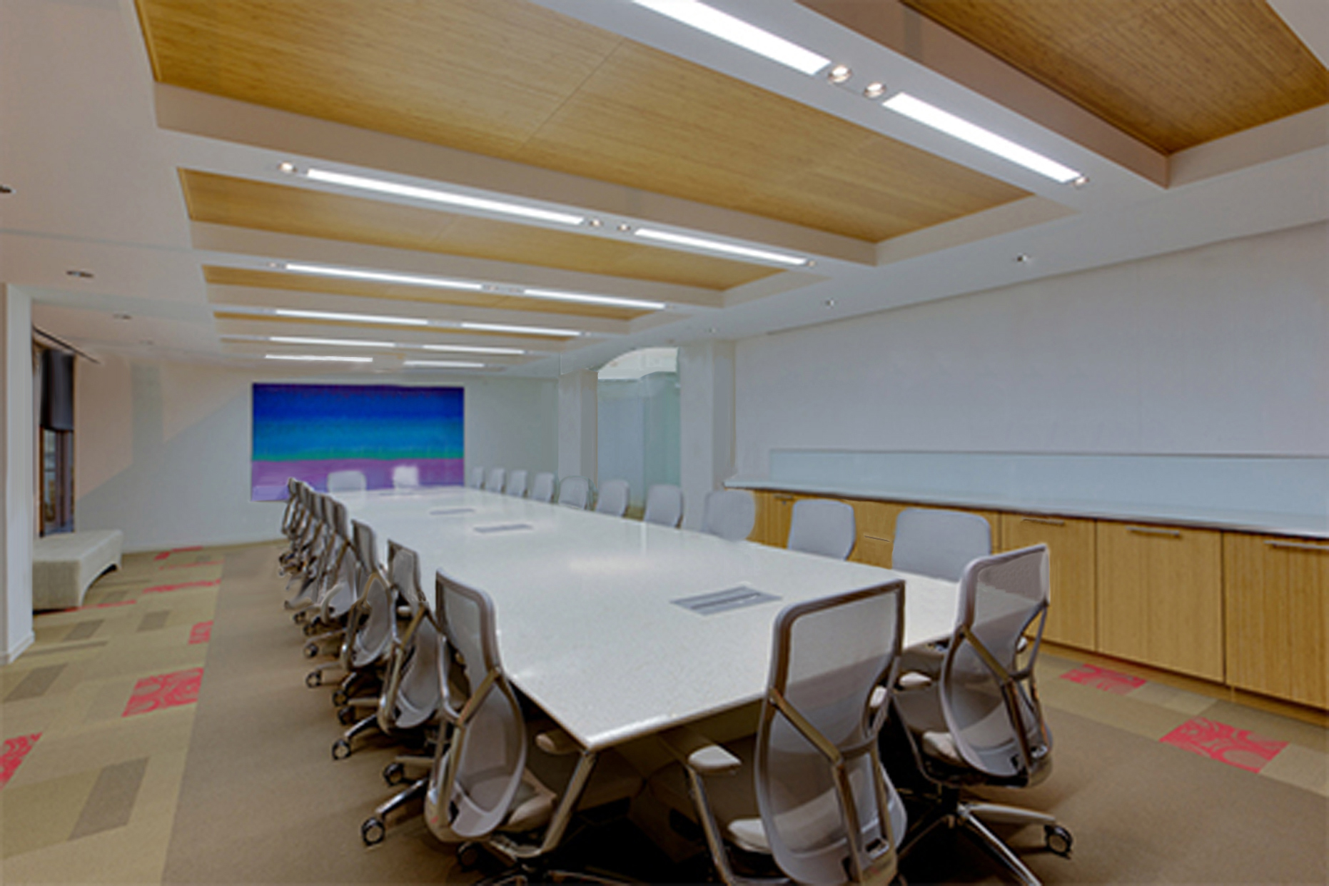 conference room with wooden ceiling panels and wooden cabinets