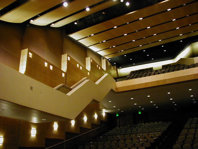 theater stairway leading to second floor of chairs with wooden walls